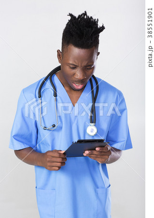 African-American doctor on a gray background African-American doctor on a gray background 38551901