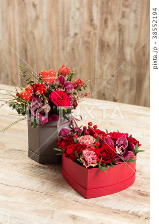 Two red boxes with flowers and gingerbread hearts 38552194