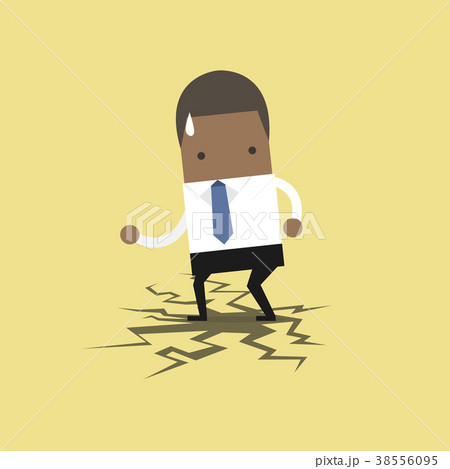 African businessman standing on cracking floor. 38556095