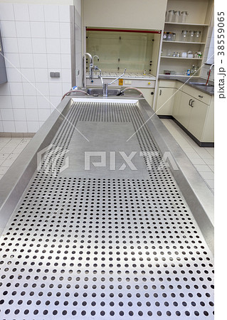 Autopsy tables in morgue 38559065