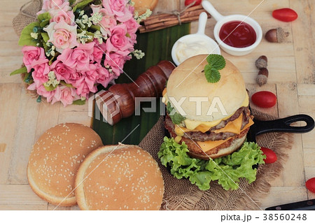 Double hamburger with double cheese is tasty. 38560248