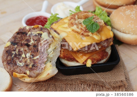 Double hamburger with double cheese is tasty. 38560386