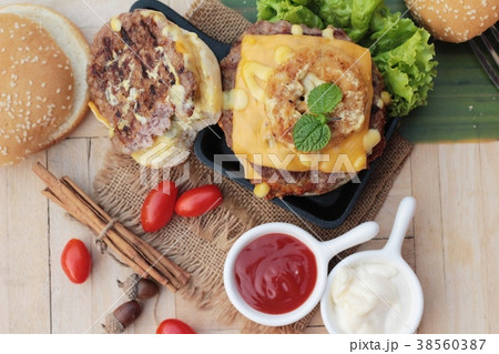 Double hamburger with double cheese is tasty. 38560387