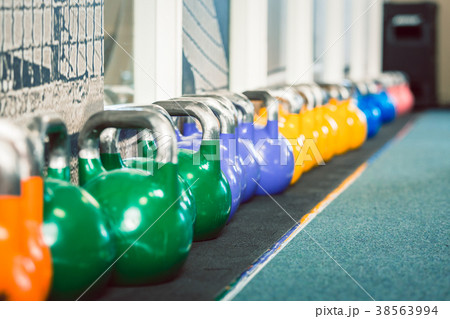Close-up of kettlebells of various weights and Close-up of kettlebells of various weights and 38563994
