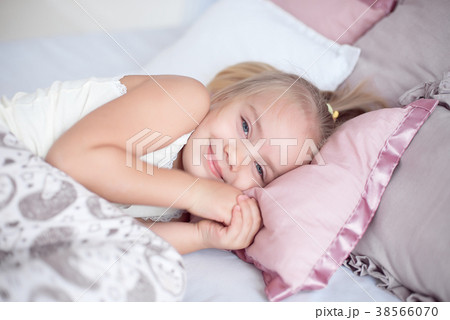 Close-up Adorable little girl sleep in the bed Close-up Adorable little girl sleep in the bed 38566070