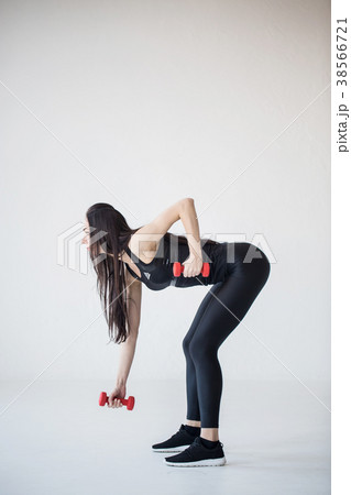 Full-length side view of the fitness girl doing 38566721