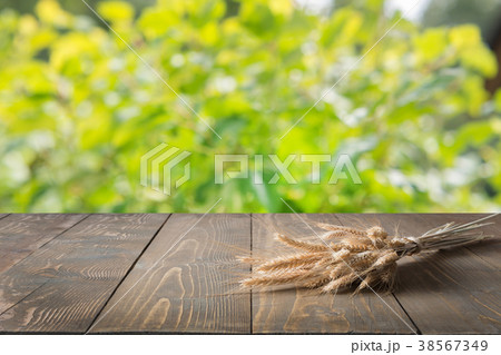 Natural background with wheat on wooden board. Natural background with wheat on wooden board. 38567349