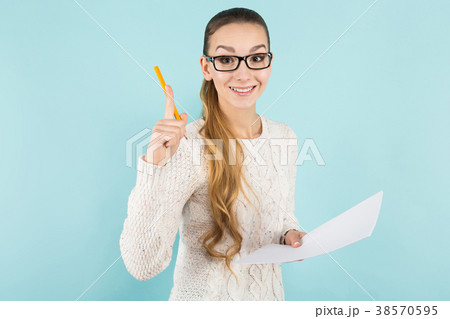 Attractive woman with ponytail and paper sheet Attractive woman with ponytail and paper sheet 38570595