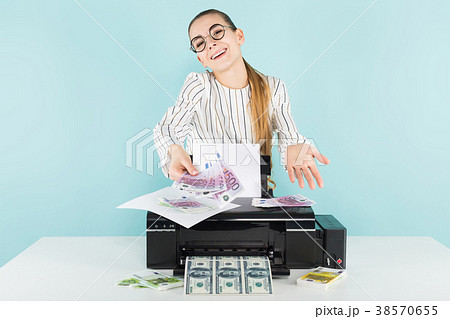 Attractive woman printing cash 38570655