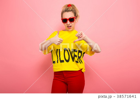Blonde woman in bright clothes Blonde woman in bright clothes 38571641