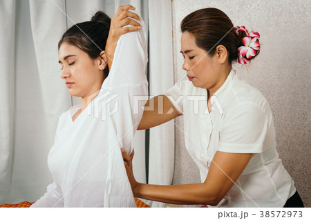 Young Girl get Thai massage for body therapy Young Girl get Thai massage for body therapy 38572973