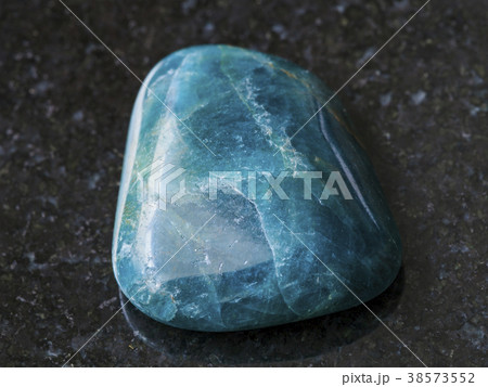 tumbled green blue Apatite gemstone on dark tumbled green blue Apatite gemstone on dark 38573552