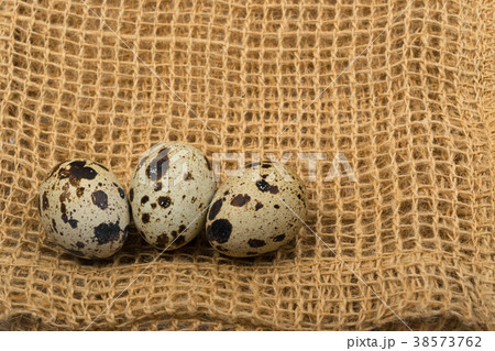 Quail Eggs on Rustic Background 38573762