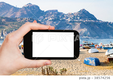 ourist photographs urban sand beach and old port 38574256