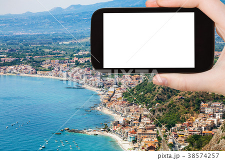 tourist photographs shore with Giardini Naxos tourist photographs shore with Giardini Naxos 38574257