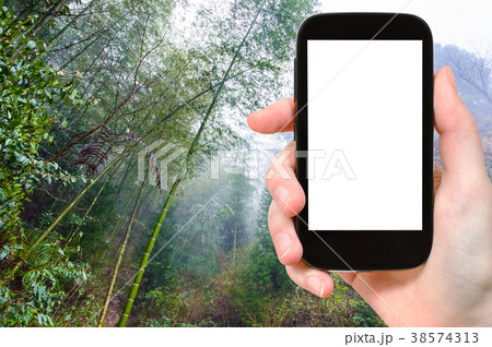 tourist photographswet rainforest in Dazhai 38574313
