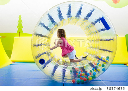Child play in roller wheel. Kids on trampoline. Child play in roller wheel. Kids on trampoline. 38574636