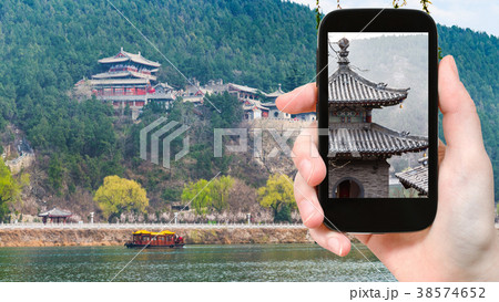 tourist photographs pagoda on Longmen Grottoes tourist photographs pagoda on Longmen Grottoes 38574652