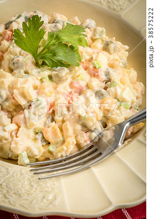 Traditional Russian vegetable salad. 38575222