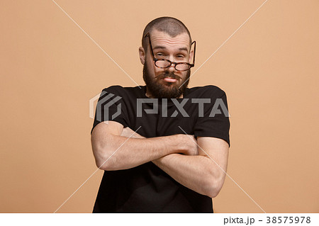 Suspiciont. Doubtful pensive man with thoughtful 38575978