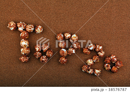 Pop Corn text wooden background  38576787