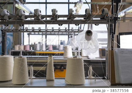 Spools with thread at rewinding machine Spools with thread at rewinding machine 38577556