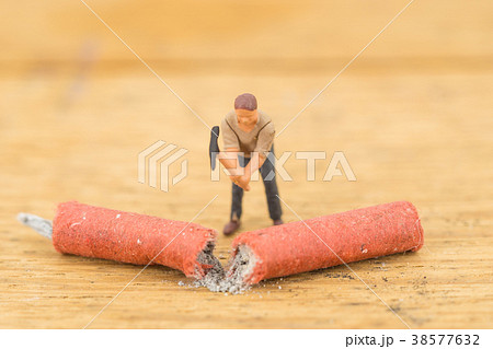 Concept miniature people destroying a Firecracker 38577632