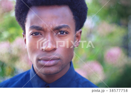 young man looking angry cynical expression suspicious wondering face 38577758