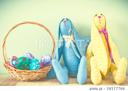 Easter bunnies on a green background Easter bunnies on a green background 38577766