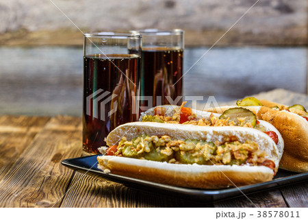 American hot dog with pickles,onions, ketchup 38578011