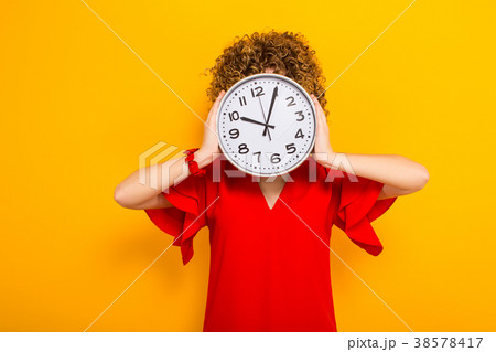 Attractive woman with short curly hair with clocks Attractive woman with short curly hair with clocks 38578417