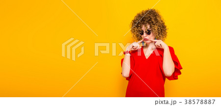 Attractive woman with short curly hair Attractive woman with short curly hair 38578887