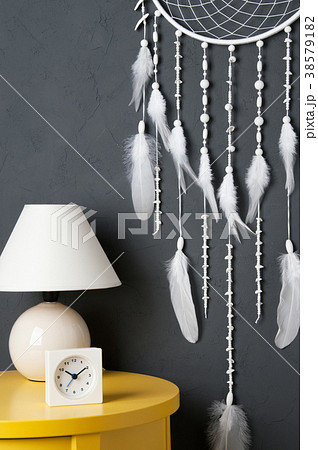 White dream catcher on gray 38579182