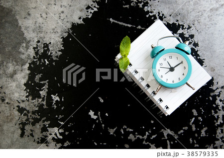 Turquoise alarm clock on black gray 38579335