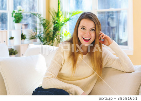 Young woman relaxing on a couch 38581651
