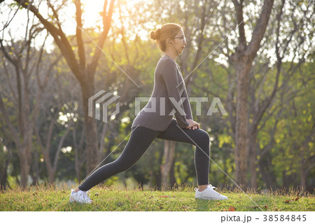Happy Asian female workout at the park. Happy Asian female workout at the park. 38584845