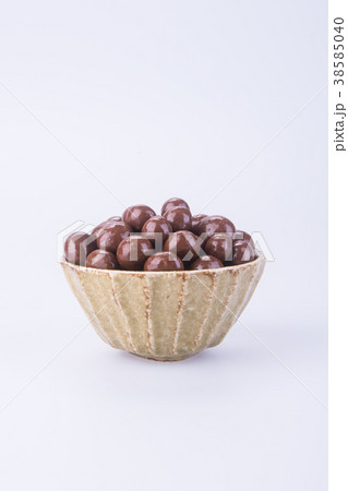 chocolate balls in bowl on a background 38585040