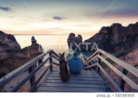 Best friends wanderlust watching sunrise at beach 38586900