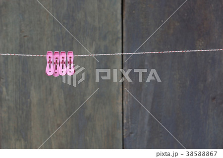 clothespins on a rope outdoors. macro clothespins on a rope outdoors. macro 38588867