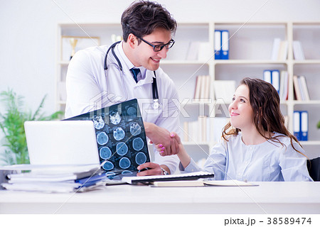 Doctor explaining to patient results of x-ray Doctor explaining to patient results of x-ray 38589474
