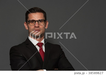 Cute businessman posing in studio Cute businessman posing in studio 38589627