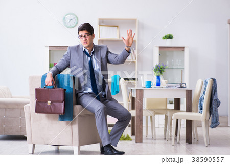 Businessman late for office due to oversleeping Businessman late for office due to oversleeping 38590557