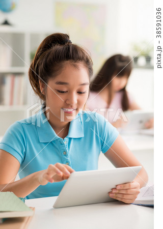 Vietnamese Pupil with Digital Tablet 38591036