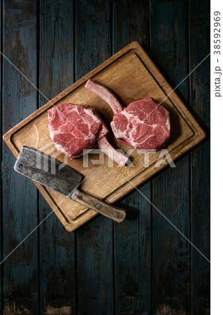 Raw tomahawk steak 38592969