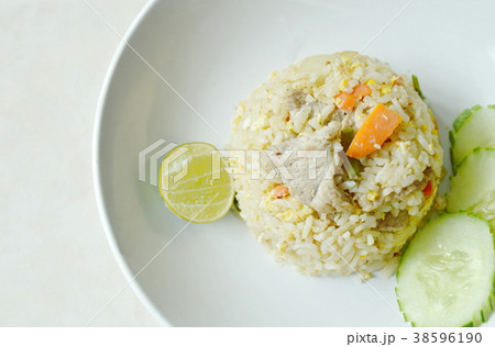 fried rice with pork and slice lemon on plate fried rice with pork and slice lemon on plate 38596190