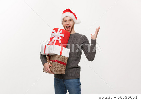 Christmas Concept - Happy young man with beard Christmas Concept - Happy young man with beard 38596631