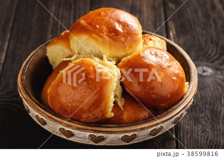 Homemade sweet bread rolls on dark background. Homemade sweet bread rolls on dark background. 38599816