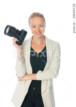 Woman photographer takes images with dslr camera 38600338