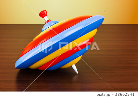 Whirligig top on the wooden table. 3D rendering 38602541
