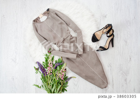 Gray suede dress and black shoes. Bouquet Gray suede dress and black shoes. Bouquet 38603305